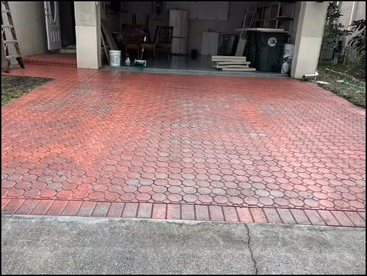 Freshly pressure washed brick paver driveway